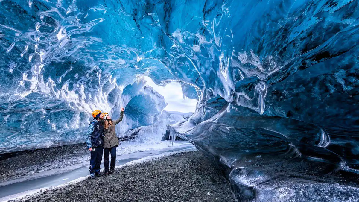 Clear sapphire walls inside the Crystal Blue ice cave, one of the Vatnajökull ice caves reached by super jeep from Jökulsárlón, Iceland